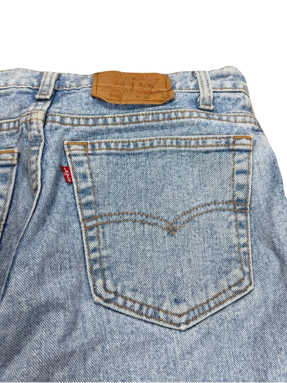 Vintage 90s Levi’s 550 Made In USA Light Wash Elongated Jean Shorts Size 33